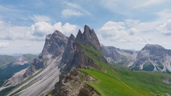 Sunrise aerial of Seceda ridge over cliffs in northern Dolomites ...