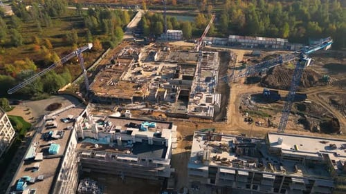 Aerial Flight Over a New Constructions Development Site. Urban Construction Site, Aerial View. High