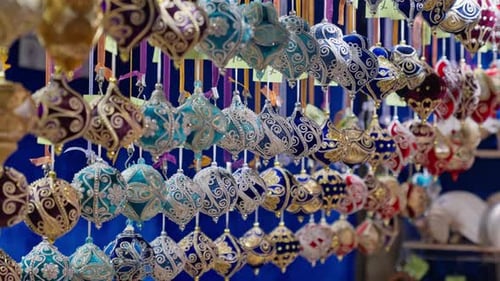 4K Row of ornate handmade Christmas Ornaments for sale at a holiday market