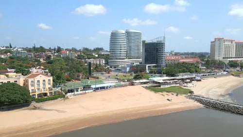 Maputo, Mozambique - A Picturesque Vista of Modern Beachfront Buildings Set Against the Clear Blue S