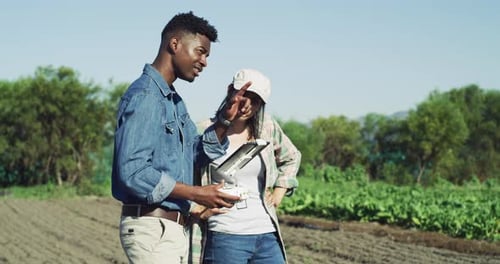 Farmers Using Tablet in Rural Field