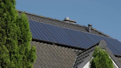 Solar Panels on House Roof on a Sunny Day