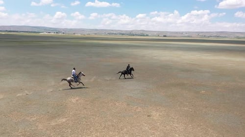Horses Running In Javelin Game With Aerial View