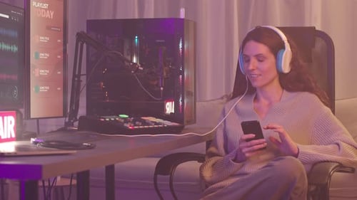 Woman Working With Audio Gear at Home