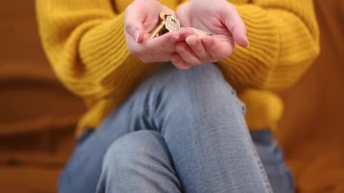 Person Holds Keys to New Home