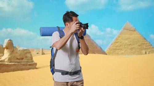 Photographer Taking Pictures of Egyptian Pyramids and Sphinx
