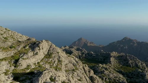 Mountainous and rugged terrain on the island of Mallorca that is washed up by the Mediterranean Sea.