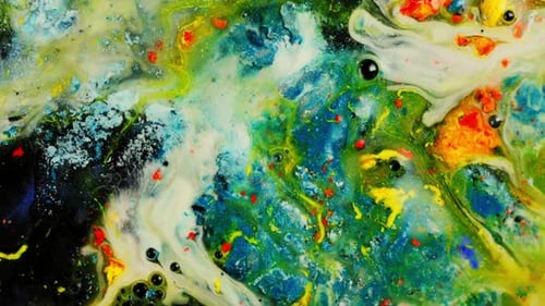 Colorful abstract paint swirling with vibrant blue, yellow, and green hues, close-up