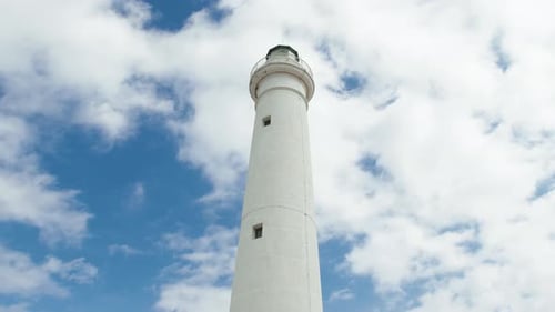 Lighthouse Tower in Daylight with Clouds