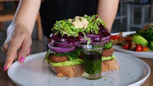 Vibrant Sandwich at Restaurant Table
