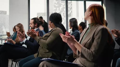 Diverse Group Applauds at a Corporate Meeting in City