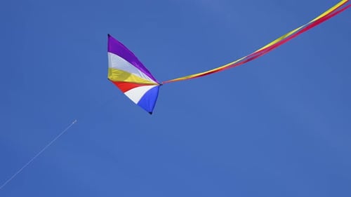 Multicolored Kite Flying in Gentle Wind Close Up City Kite Festival