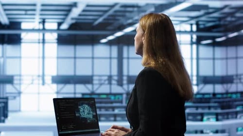 IT Professional Working on Notebook with AI Machine Learning Algorithms