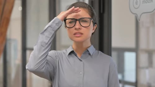 Searching Young Indian Businesswoman at Workplace