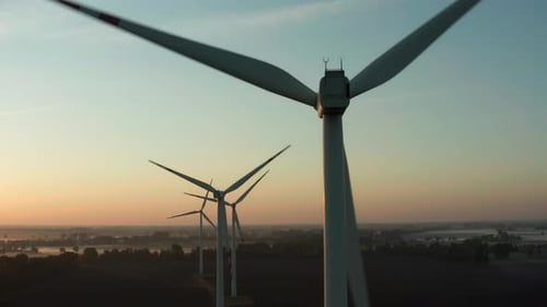 Eco Farm Wind Turbines at Sunrise Aerial View Closeup