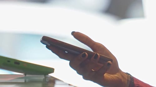 Using a smartphone for touchless pay at the register - isolated slow motion