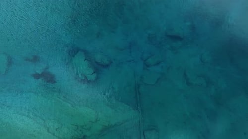 This Aerial View Captures a Tranquil Water Surface Perfect for Relaxation and Meditation