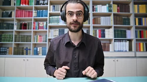 Webcam View Young Talking Man Making Video Call Chat Conference in Library