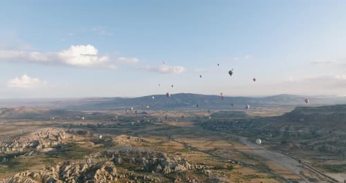 A Majestic Ascent of Hot Air Balloons Over Göreme National Park, Cappadocia, Turkiye