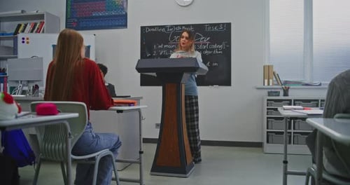 Teenager Giving Presentation to Class in School
