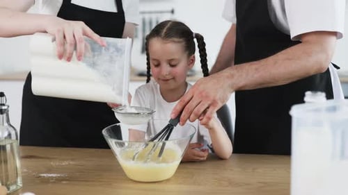 Family Baking Together in a Bright Modern Kitchen