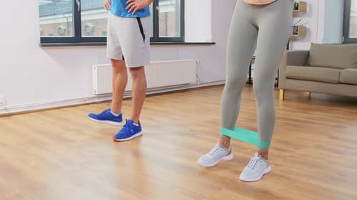 Sport, Fitness, Lifestyle and People Concept - Smiling Man and Woman Exercising