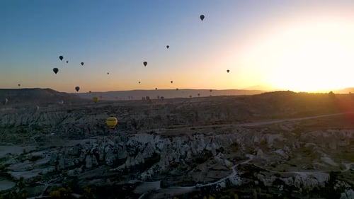 hot air balloons flying over Cappadocia on sunrise time - Göreme, Turkey