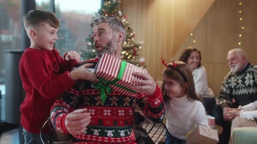 Happy Family Celebrates Christmas with Gifts and Hugs