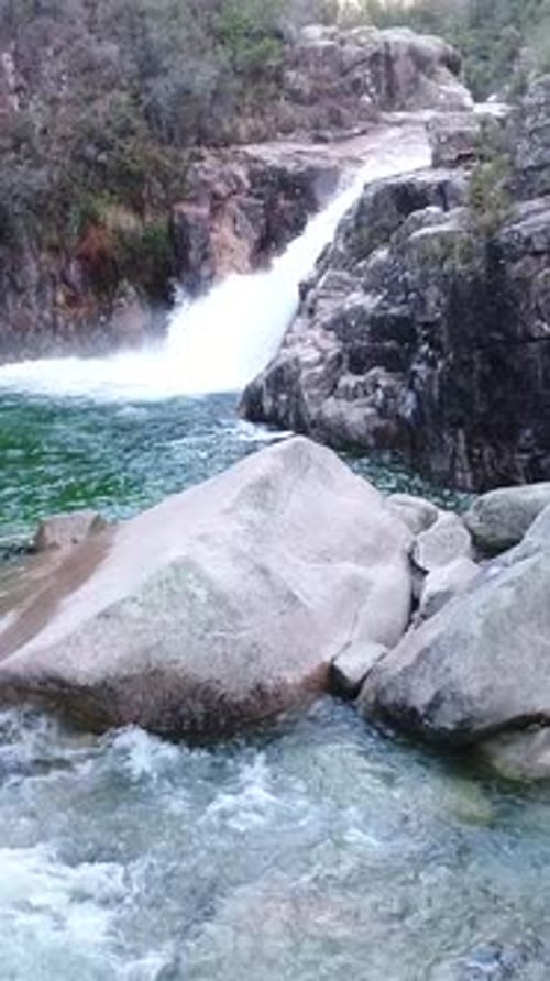 Vertical Video of Beautiful Mountain River with Cascades Flowing on Rocks