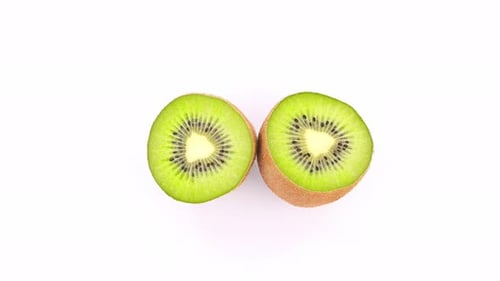 Fresh Kiwi Fruit Halves on White Background
