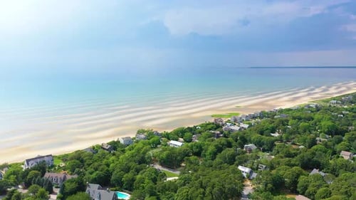 High Aerial of Cape Cod Beach Houses and Coastline Beneath Overcast