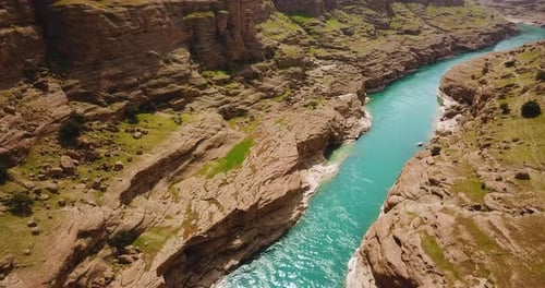 fly over turquoise color river flow in nature the canyon adventure rock cliff valley in middle east