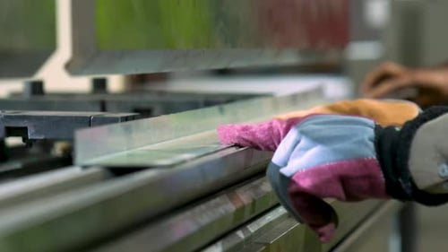 Steel Sheet Metal Being Bent On A Industrial Hydraulic Press Brake During Manufacturing Production.