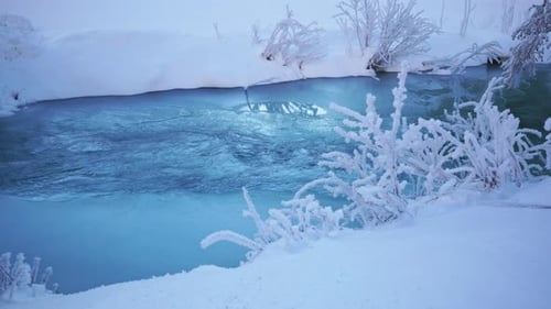 Frozen river with snow around