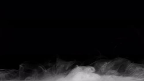 Wispy White Smoke Flowing Across Black Background
