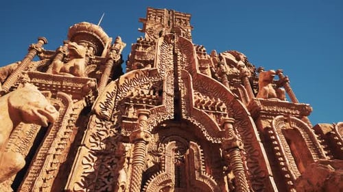 A Grand Temple with Ornate Statues Adorning Its Walls