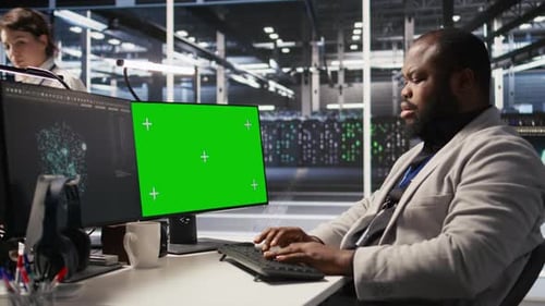 Data Center Programmer Working on Green Screen Desktop PC