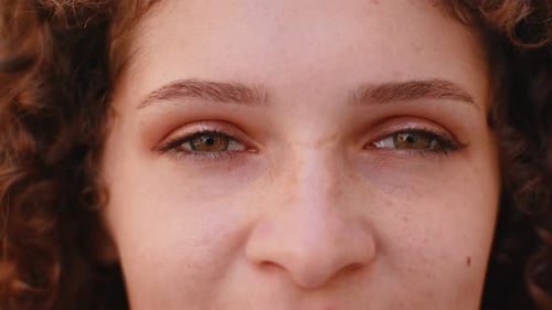 Close Up of Woman's Face with Different Colored Eyes