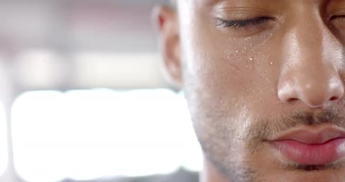 Sweating and focusing, man in gym during intense workout session, copy space