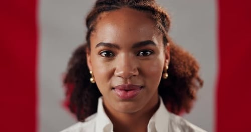 Smiling Young Adult in front of Canadian Flag
