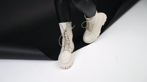 Stylish Boots Posed Against Black and White Background