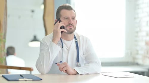 Doctor Talking on Phone in Clinic