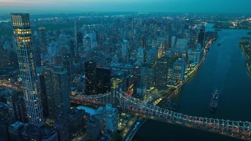 New York city in lights in the evening time. Lively and vibrant city from aerial perspective.