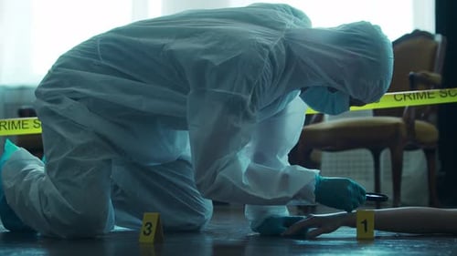Forensic Scientist Investigating Evidence at Crime Scene