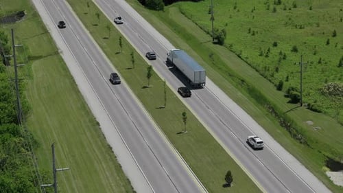 Aerial Top Down Wide View of Traffic Highways with Moving Cars and Trucks r