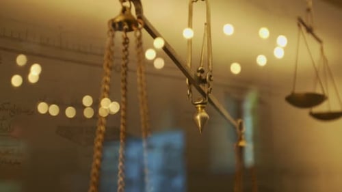 Shooting the golden scale from behind glass. yellow light.