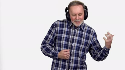 Man Pretends to Play Air Guitar with Headphones