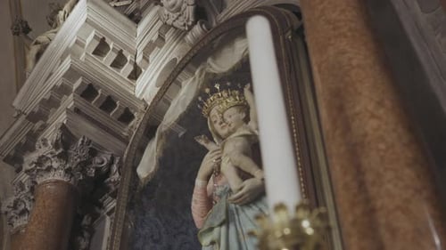 Tracking Statue Of Mother Mary Holding Baby Jesus In Historical Church.