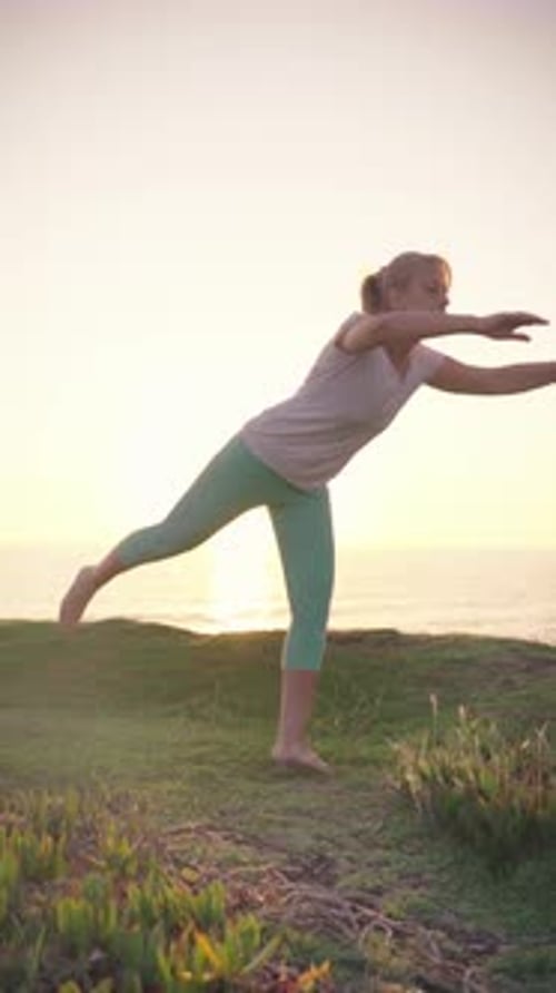 Sunset Yoga Session By the Ocean With Serene Surroundings During Golden Hour