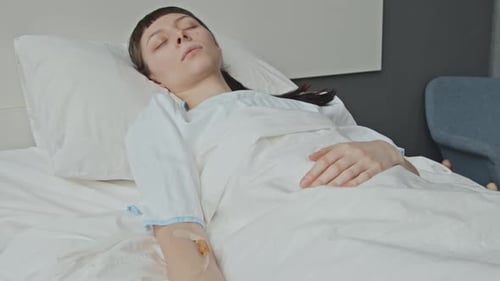 Woman in Coma in Hospital Bed